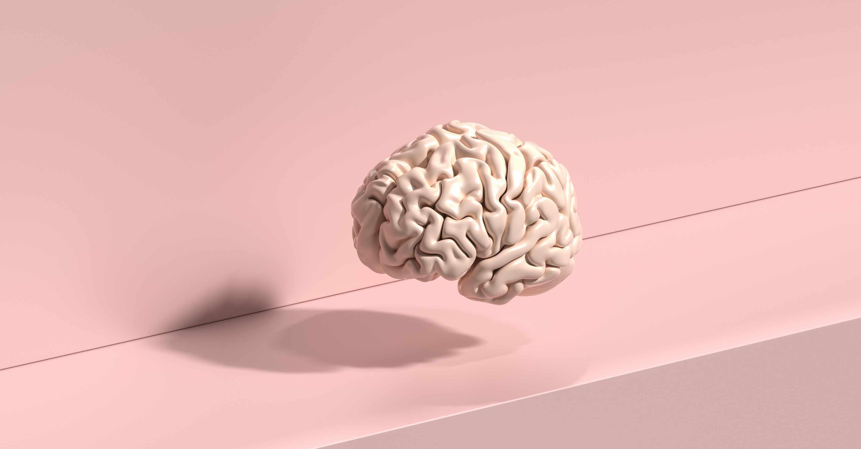 Brain floating on a pink background